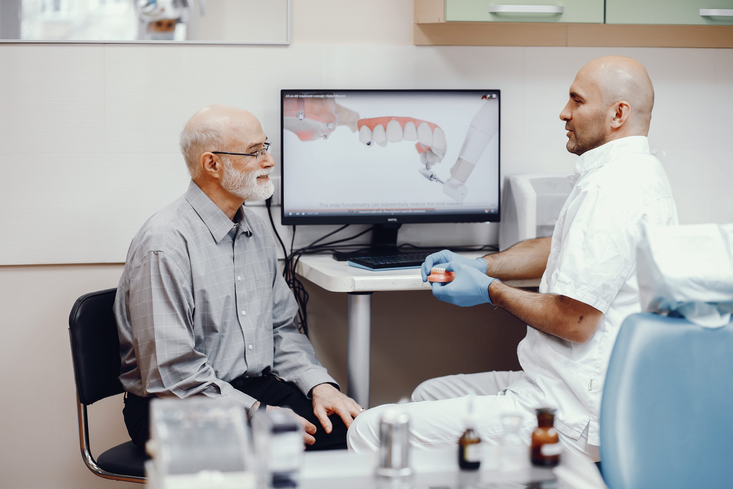 old man getting dental bridges service
